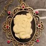 Snake charmer cameo necklace