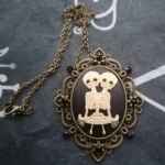 Conjoined twin cameo necklace