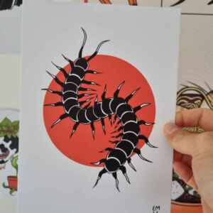 An art print of a centipede, with a red circle behind it. The colour of the centipede is black with white highlights