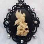 Goth fairly on a skull necklace