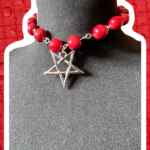 Bright red wooden bead choker with inverted star pendant