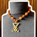 Juicy orange wooden choker with gold sigil of Lucifer pendant