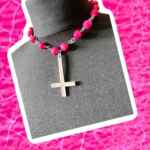 Hot pink choker with stainless steel inverted cross