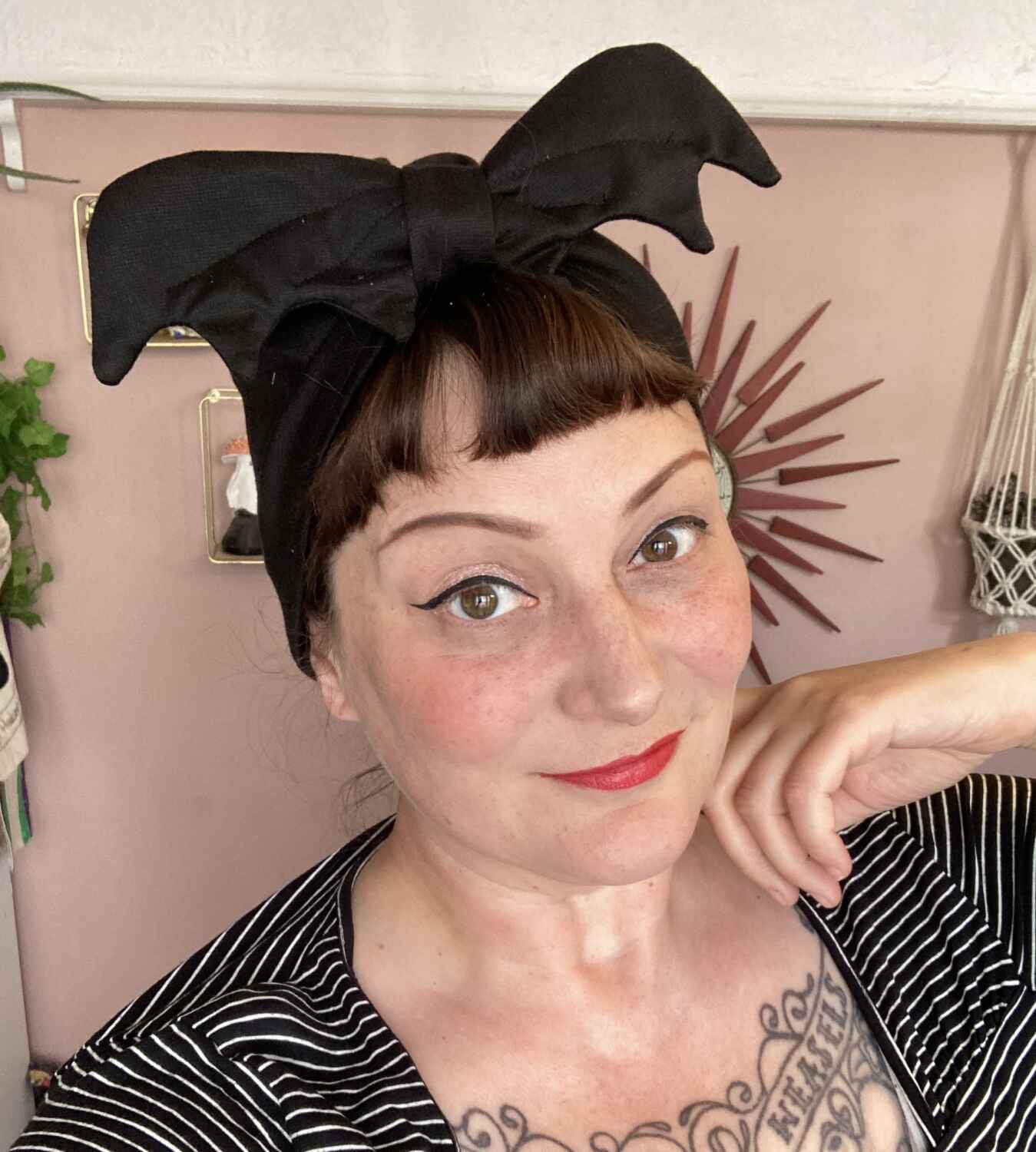 84A814F8-B7AC-4151-8806-3FDE3F5E07A1 woman in bat headband