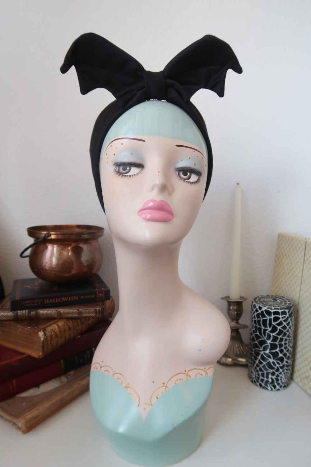 unnamed copy 2 display head wearing a black bat headband