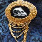 Vulture skull brooch