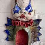 Winged Baby Jester candle holder